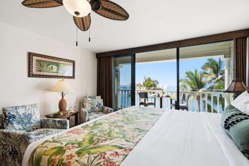 a bedroom with a bed with a view of the ocean at Lahaina Shores 515 in Lahaina