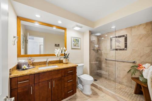 a bathroom with a shower and a toilet and a sink at Lahaina Shores 515 in Lahaina