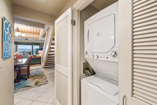 a laundry room with a washer and dryer at Kahana Village 4 in Lahaina