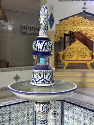 a blue and white vase sitting on top of a plate at Morjana Castle in Sousse