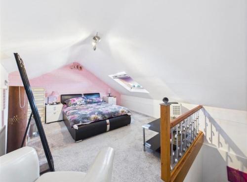 a bedroom with a bed in a attic at Lake District Gate in Lancaster