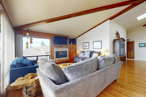 a living room with a couch and a table at Pinnacle Heights in Bodega Bay