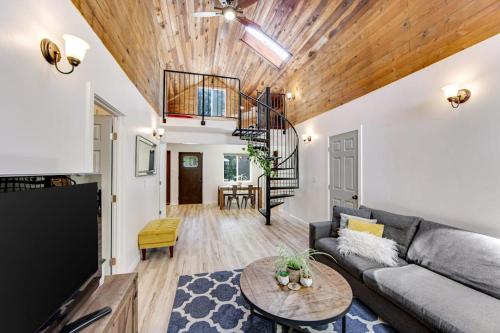 a living room with a couch and a table at Canyon House in Guerneville