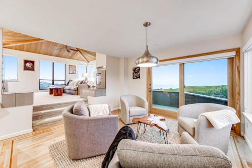 a living room with chairs and a living room with a view at Latitude 38 in Bodega Bay
