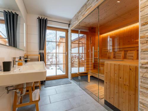 a bathroom with a sink and a shower at Haus Laura in Donnersbachwald