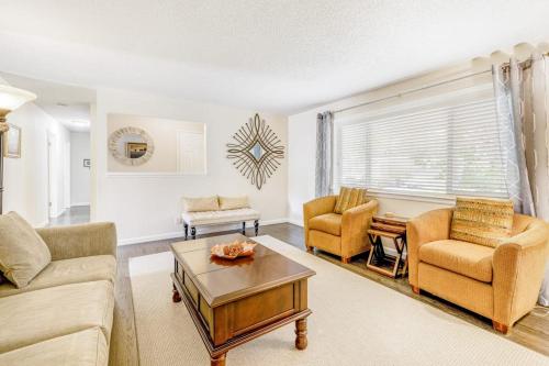 a living room with a couch and chairs and a table at Kenwood Retreat in Kenwood
