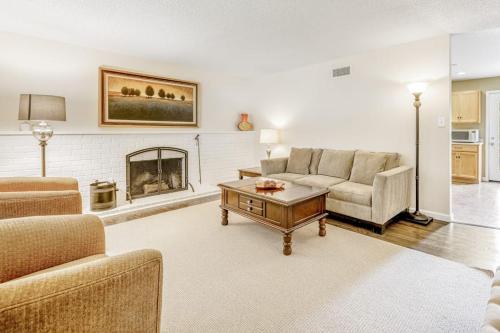 a living room with a couch and a fireplace at Kenwood Retreat in Kenwood