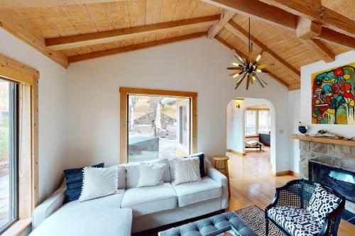 a living room with a couch and a fireplace at Warm Springs Paradise in Glen Ellen