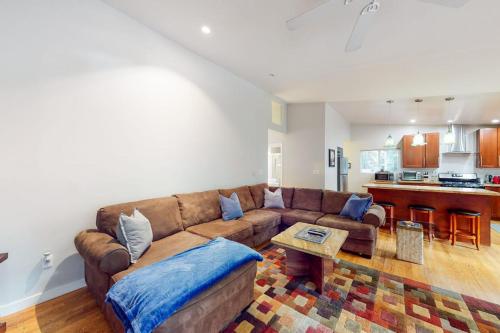 a living room with a couch and a table at River Paradise in Guerneville