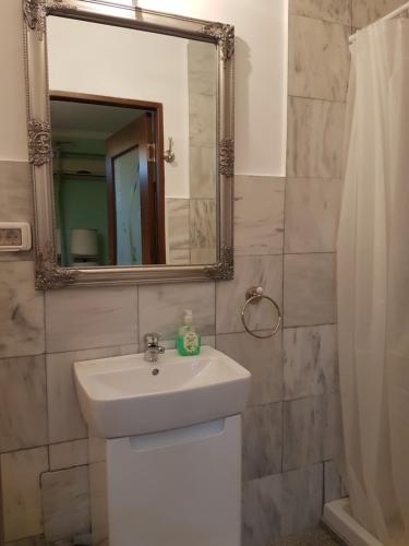 a bathroom with a sink and a mirror at Bucharest Boutique Accommodation by Hotels in Bucharest
