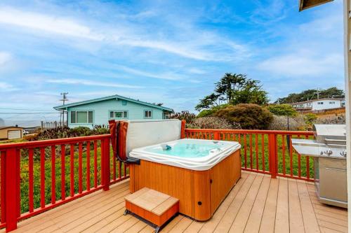a hot tub sitting on top of a deck at Coastal Dream in Bodega Bay
