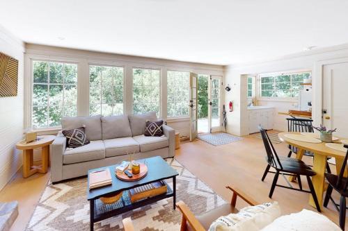 a living room with a couch and a table at Hidden Acres Retreat in Guerneville