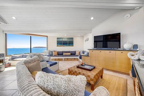 a living room with a couch and a table at Blue Horizon in Bodega Bay