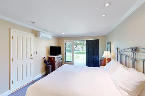 a bedroom with a large white bed and a television at Silverado Resort and Spa 382 in Napa