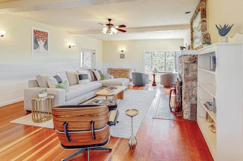 a living room with a couch and a table at Dragon Cottage in Healdsburg