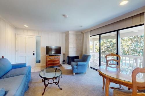 a living room with a blue couch and a table at Silverado Resort and Spa 221 in Napa