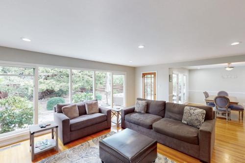 a living room with a couch and a table at Jewell Dreams in Santa Rosa