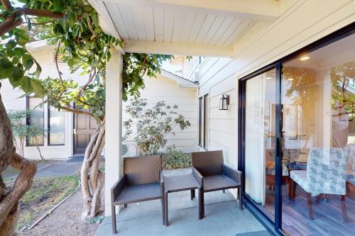 a porch with two chairs and a table at Silverado Resort and Spa 353 in Napa