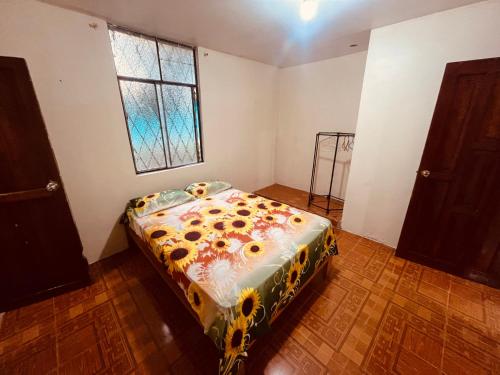 a bedroom with a bed in a room with a window at Apt 8 in Tena