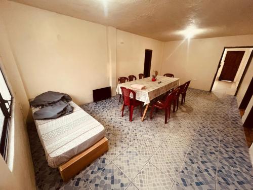 a room with a table and chairs and a dining room at Apt 8 in Tena