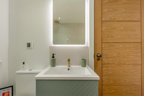 a bathroom with a white sink and a mirror at 2 Bed in Waldron oc-v33536 in Waldron