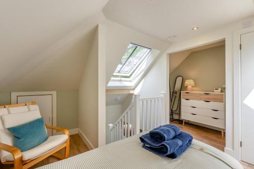 a bedroom with a bed and a chair and a window at 2 Bed in Waldron oc-v33536 in Waldron
