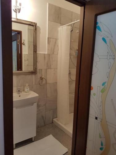 a bathroom with a sink and a toilet and a shower at Bucharest Boutique Accommodation by Hotels in Bucharest