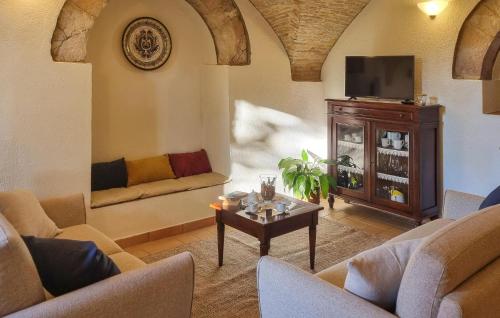 a living room with couches and a tv at Monica in Assisi