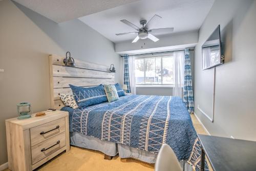 a bedroom with a bed and a ceiling fan at Newly Renovated Condo in Harborside! in South Haven