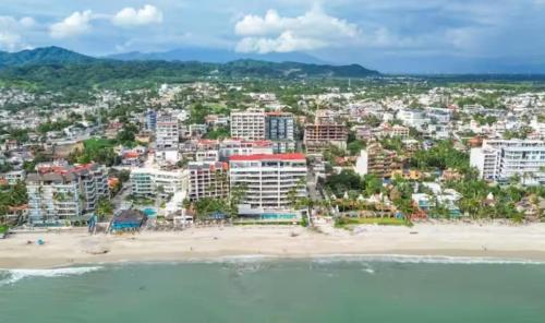 an aerial view of a beach and buildings at Maralma Bucerias 1 half Blocks from Beach Sleeps 4 in Bucerías