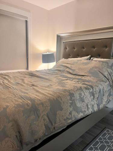 a bedroom with a large bed with a headboard at Peace House in Bills Island