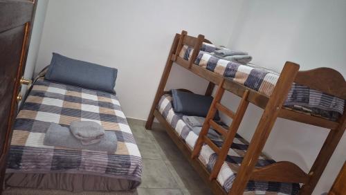 a couple of bunk beds in a room at El hogarcito in Cafayate