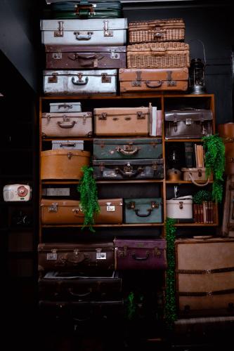 a pile of suitcases stacked on top of each other at The Great Central Hotel in Glen Innes