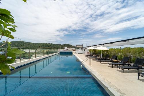 a swimming pool on the roof of a building at Kantary Hotel Banchang in Ban Chang