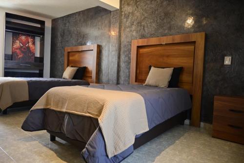 a hotel room with two beds in a room at Santa Martha Hotel Boutique in Progreso de Obregón