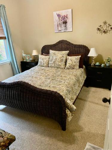 a bedroom with a large bed with pillows on it at Chalet Suzanne in Helen