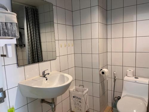 a bathroom with a sink and a toilet at Mae Phim beach in Ban Tha Fat