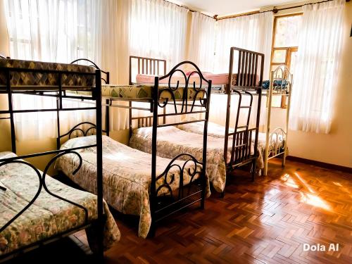a room with four bunk beds in it at Casa Betania in La Paz