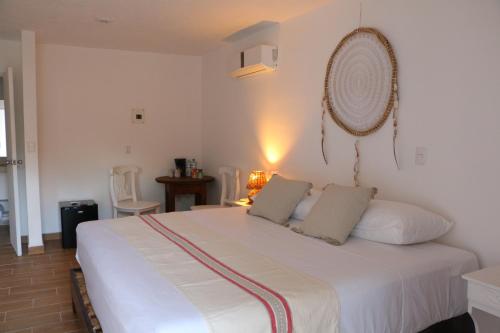 Postel nebo postele na pokoji v ubytování Hotel El Capitan