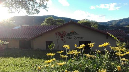 a building with a sign that reads cold season at Hostel Serena in Samaipata