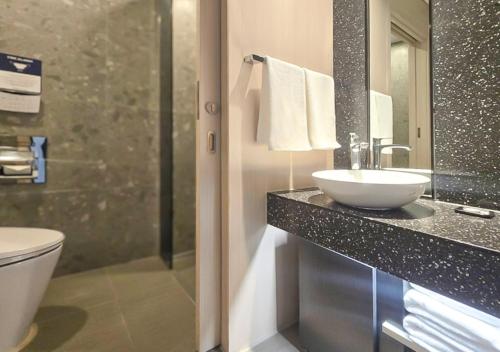 a bathroom with a sink and a toilet at Kinstay Hotel in Goyang