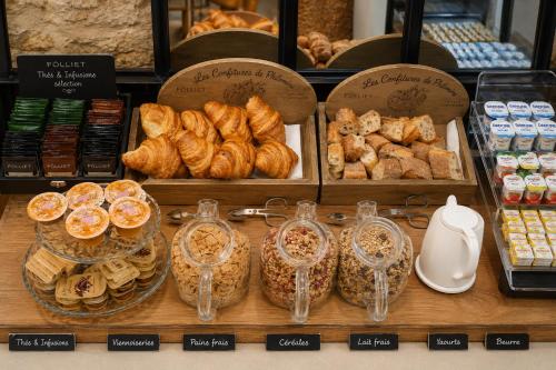 a display of bread and pastries in a bakery at Port Royal Hotel in Paris