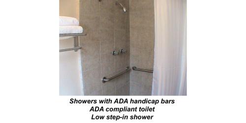 a bathroom with a shower with a shower curtain at At Home Express Tangerine Inn in DeLand