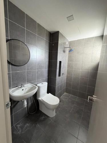 a bathroom with a toilet and a sink at Sufi Idaman Homestay for Islamic only in Nilai