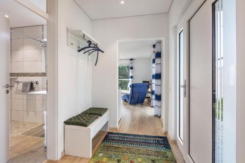 a room with a hallway with a bathroom with a sink at Ferienwohnung Am Hochrhein in Murg