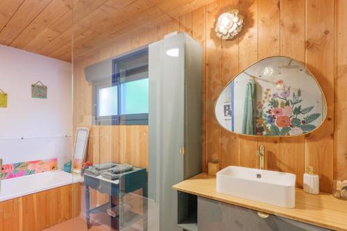 a bathroom with a sink and a mirror at Casa Frida in Salavas