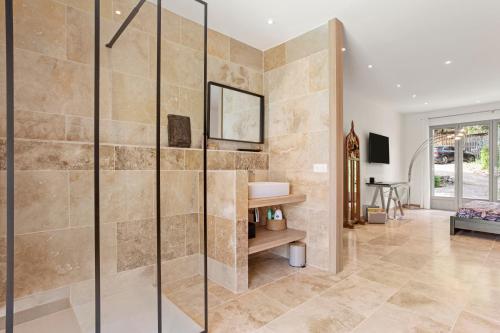 a bathroom with a shower and a sink at Chambres D’hôte Cotignac in Cotignac