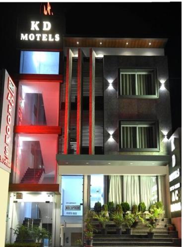 a building with a sign on the side of it at K D Motels in Patiāla