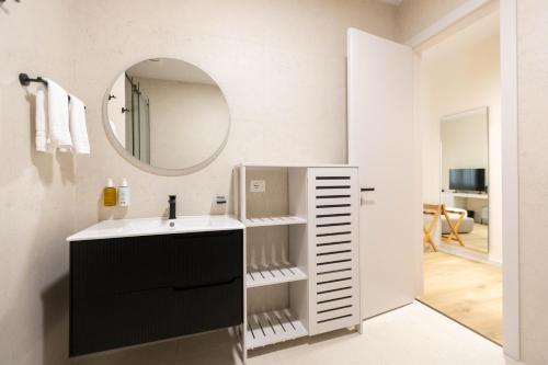 a bathroom with a sink and a mirror at Pauz Hotel in Himare