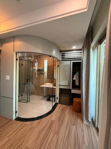 a bathroom with a shower and a glass door at Đảo Yến Hotel 2 in Dong Hoi